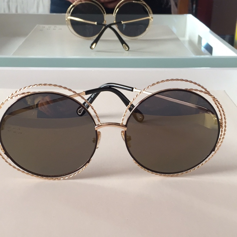 Green round frame sunglasses with gold hardware